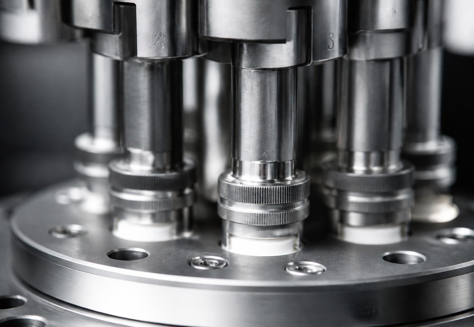 Macro detail of precision-machined pharmaceutical tablet press tooling